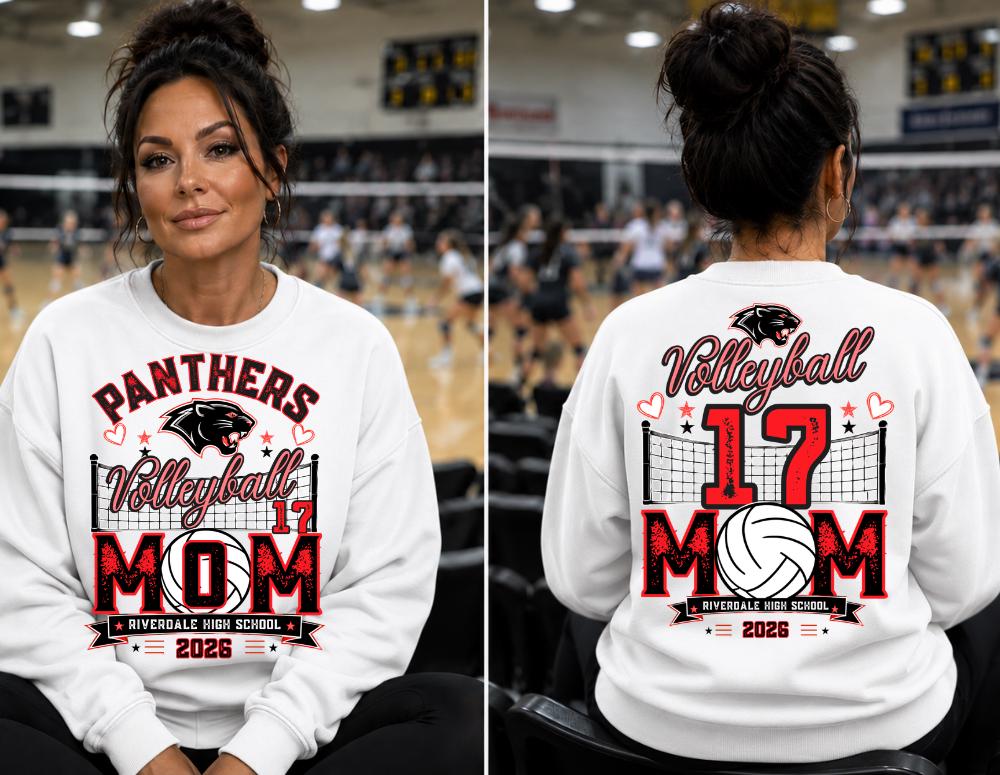 May include: A white crewneck sweatshirt featuring a graphic print with the text Panthers Volleyball 17 MOM Riverdale High School 2026. The design includes a black panther head, a volleyball net, a volleyball, and small red hearts and stars.